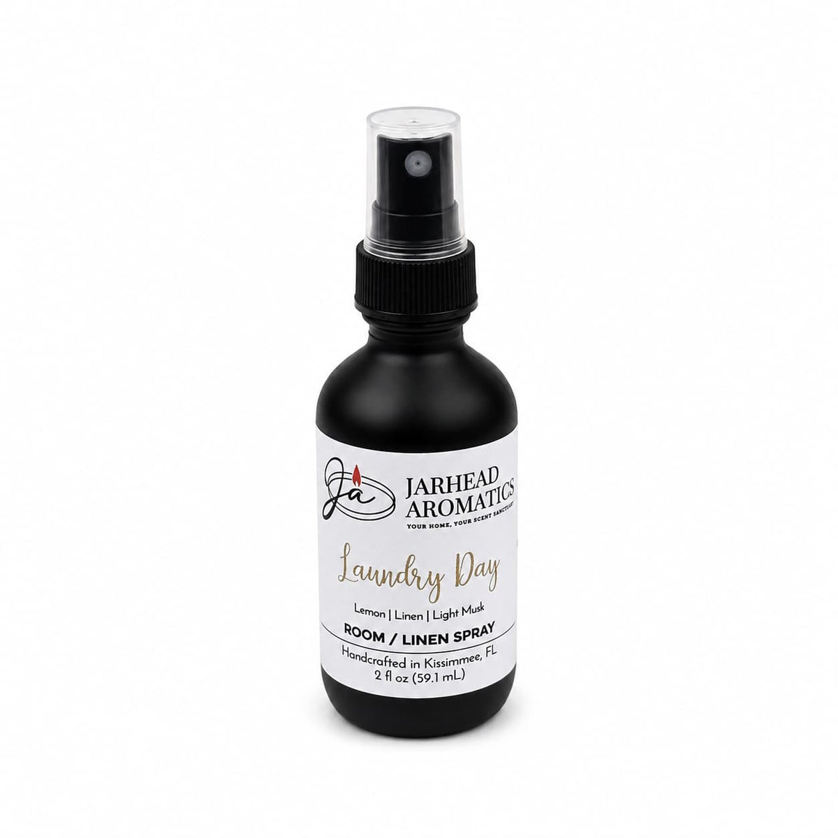 Introducing Jarhead Aromatics Laundry Day Room & Linen Spray in a sleek black 2 fl oz bottle. This handcrafted spray from Kissimmee, FL blends fresh linen, lemon, and clean musk for an uplifting home fragrance experience.
