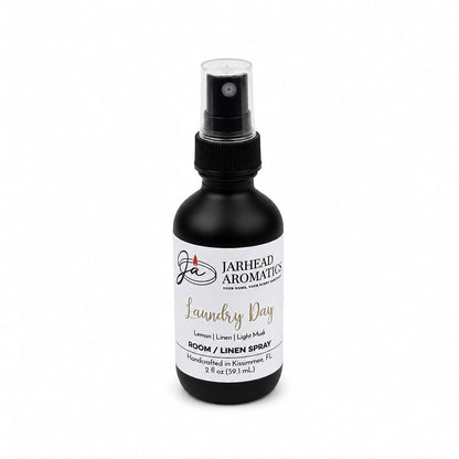 Introducing Jarhead Aromatics Laundry Day Room & Linen Spray in a sleek black 2 fl oz bottle. This handcrafted spray from Kissimmee, FL blends fresh linen, lemon, and clean musk for an uplifting home fragrance experience.