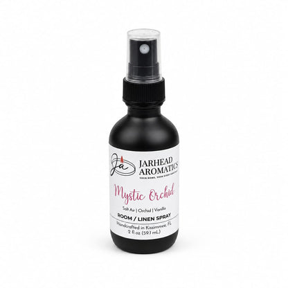 Introducing the Mystic Orchid Room & Linen Spray by Jarhead Aromatics—a hand-crafted 2 fl oz black spray bottle filled with a coastal floral fragrance of orchid, salt air, and vanilla. Made in Kissimmee, FL, this home scent blends fresh and sweet notes into any space.