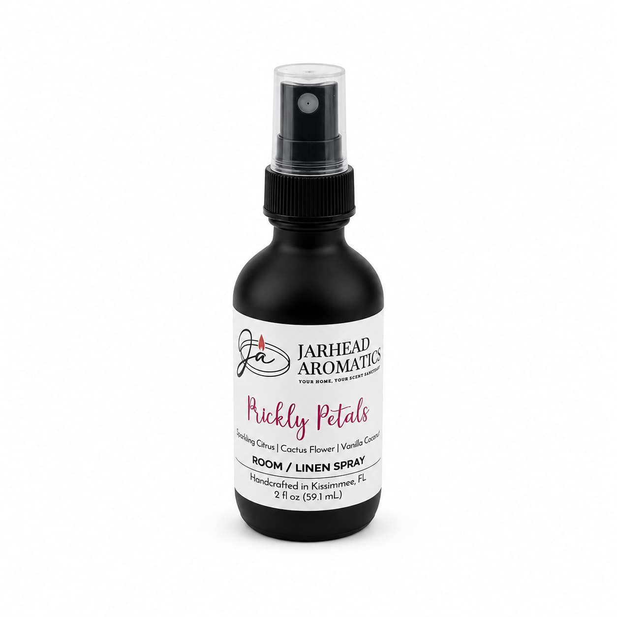 A black spray bottle labeled Jarhead Aromatics Prickly Petals Room & Linen Spray, featuring a desert-inspired fragrance with notes of cactus flower, coconut, and sandalwood. Bottle size is 2 fl oz (59 ml).