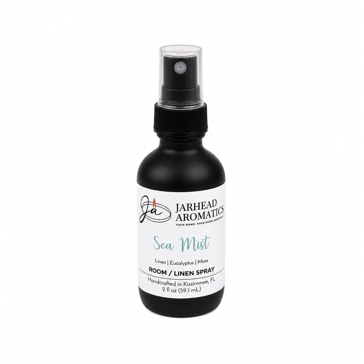 A black spray bottle labeled Jarhead Aromatics Sea Mist Room & Linen Spray in the Fresh Linen, Sea Salt & Eucalyptus scent (2 oz) evokes a spa-inspired experience—perfect for adding a touch of coastal fragrance to your home. Displayed on a white background.