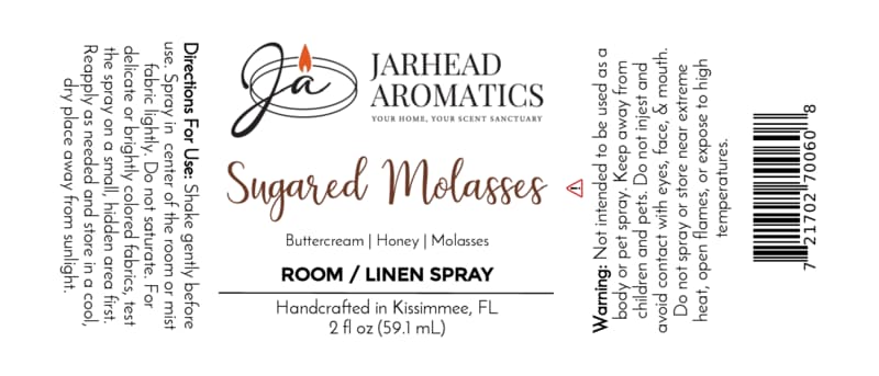 Jarhead Aromatics’ Sugared Molasses Room & Linen Spray | Buttercream, Honey & Dark Molasses label displays full usage directions, a comprehensive ingredient list—including buttercream, honey, and dark molasses—as well as key warnings and a barcode. This handcrafted gourmand home fragrance is made in Kissimmee, FL. The label design features a white background with black and orange lettering.