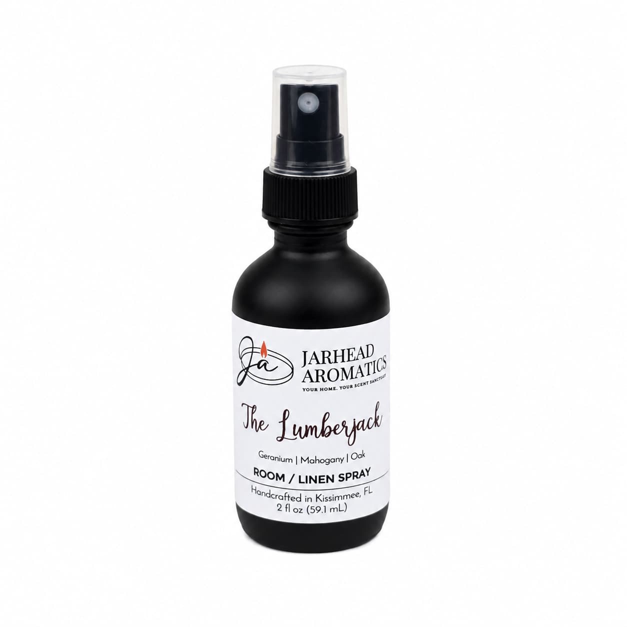 A black spray bottle labeled Jarhead Aromatics The Lumberjack Room & Linen Spray, handcrafted in Kissimmee, FL, features a woodsy home fragrance with notes of mahogany, cedarwood, and oak. Available in a 2 fl oz size for a refreshing touch to any room or linen.