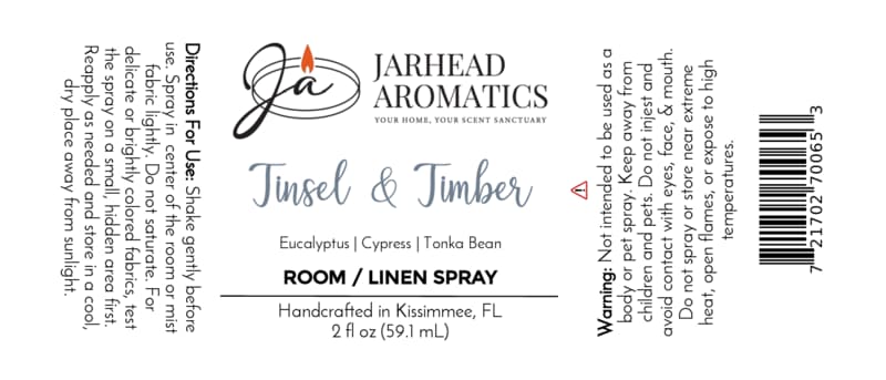 Label for Jarhead Aromatics Tinsel & Timber Room & Linen Spray featuring a winter forest scent of eucalyptus, cypress, and tonka bean, including directions, warnings, and a barcode.