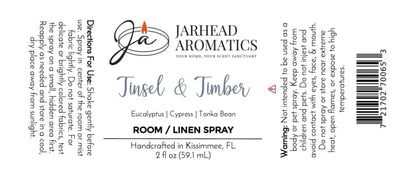 Label for Jarhead Aromatics Tinsel & Timber Room & Linen Spray featuring a winter forest scent of eucalyptus, cypress, and tonka bean, including directions, warnings, and a barcode.