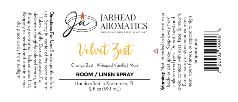 Certainly! Here’s a rewritten sentence using the provided product data: White product label for Jarhead Aromatics Velvet Zest Room & Linen Spray | Citrus, Vanilla & Brown Sugar, a home fragrance spray with scent notes of orange zest, whipped vanilla, and musk. Includes directions for use, safety warnings, 2 fl oz bottle size details, and features a candle logo at the top.