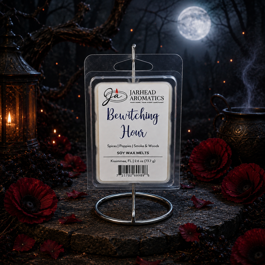 A package of Bewitching Hour Soy Wax Melt | Exotic Spices, Dark Florals & Smoky Woods by Jarhead Aromatics rests on a stand, encircled by red poppies, a lantern, and a cauldron in a moonlit, mystical outdoor scene. This enchanting wax melt fills the night air with its long-lasting aroma of exotic spices, dark florals, and smoky woods.