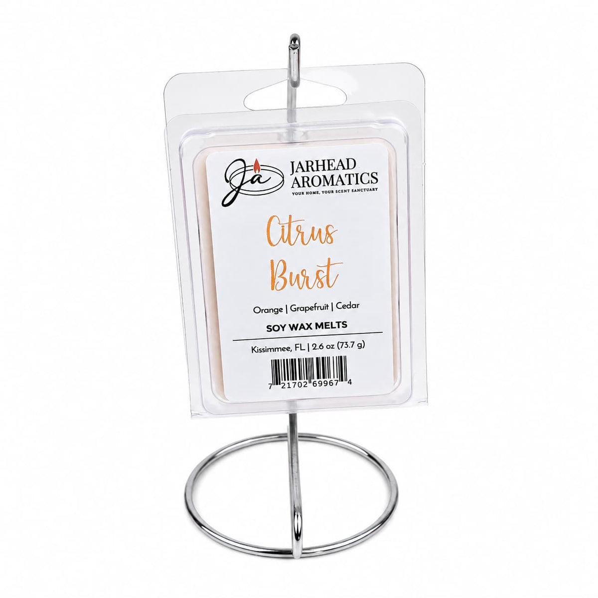 A package of Jarhead Aromatics Citrus Burst Soy Wax Melt | Orange, Mango, Peach & Grapefruit, ideal for enhancing your home fragrance experience, is showcased on a simple silver metal stand against a white background.