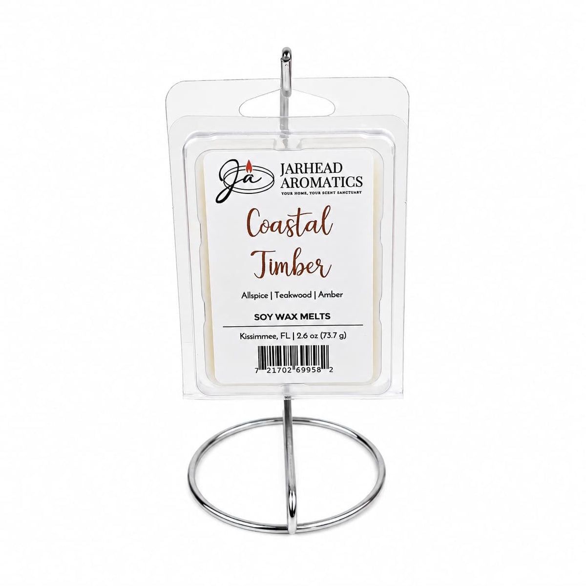 A package of Jarhead Aromatics Coastal Timber Soy Wax Melt | Teakwood, Leather & Warm Amber is displayed on a silver metal stand against a white background, perfect for enhancing your home fragrance.