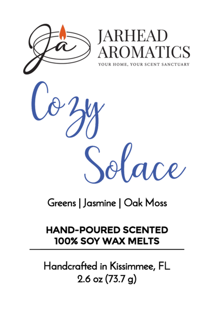 Product label for Jarhead Aromatics Cozy Solace - Soy Wax Melt (Fall Collection), scented with fresh greens, jasmine, and oak moss. Handcrafted in Kissimmee, FL. Includes logo, product info, and net wt. 2.6 oz.