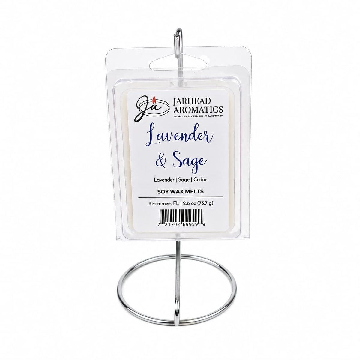 A package of Jarhead Aromatics Lavender & Sage Soy Wax Melt | Lavender, Sage & Sandalwood is displayed upright on a silver metal stand against a white background, highlighting this calming home fragrance and inviting the soothing aromas of lavender, sage, and sandalwood into your space.