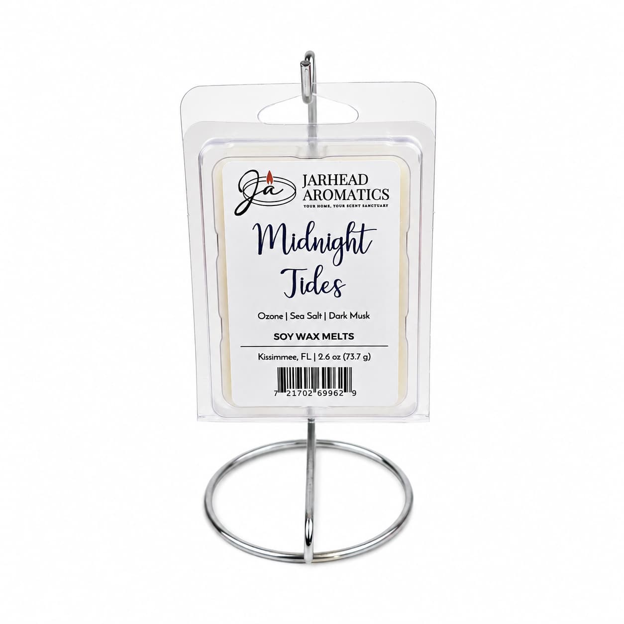 A Jarhead Aromatics Midnight Tides Soy Wax Melt pack, featuring sea salt, sandalwood, and dark musk fragrances, is displayed on a metal stand. The label highlights its aquatic and long-lasting scent.