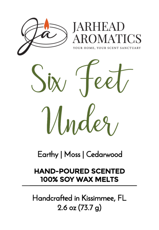 A label for the Jarhead Aromatics Six Feet Under Soy Wax Melt | Damp Earth, Moss & Ancient Oak, featuring a dark, atmospheric blend of earthy notes with moss and ancient oak. The label emphasizes that it’s handcrafted in Kissimmee, FL, and contains 2.6 oz (73.7 g).