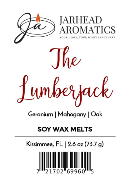 Jarhead Aromatics The Lumberjack Soy Wax Melt label showcases a woodsy fragrance blend featuring mahogany, cedarwood, and oak notes. The label includes the barcode, weight (2.6 oz), and location (Kissimmee, FL).