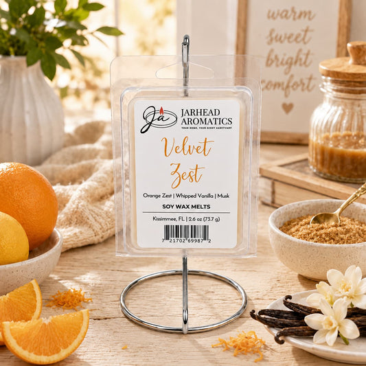 A pack of Jarhead Aromatics Velvet Zest Soy Wax Melt | Citrus, Vanilla & Caramel sits on a metal stand, surrounded by oranges, a bowl of brown sugar, and vanilla beans in a cozy kitchen setting—this gourmet fragrance blend fills your home with the warm and inviting essence of citrus, vanilla, and caramel.