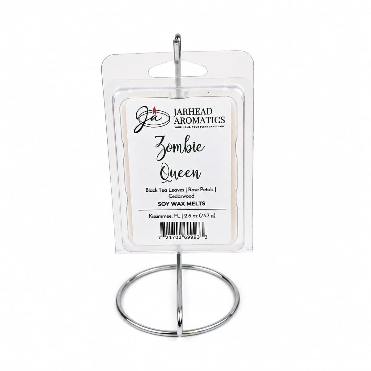 A package of Jarhead Aromatics Zombie Queen Soy Wax Melt—featuring the black tea, rose petals, and cedarwood fragrance—is displayed upright on a silver metal stand against a white background.
