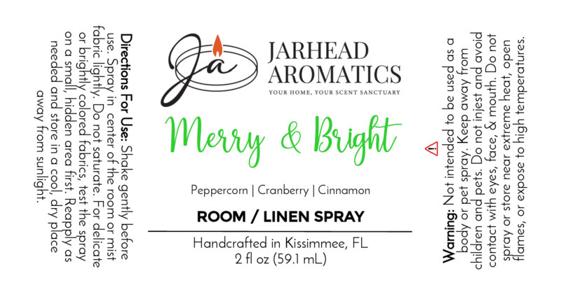 A white label for Jarhead Aromatics’ Merry & Bright - Room / Linen Spray - Winter Collection includes directions, a warning, festive scent notes (peppercorn, cranberry, cinnamon), and handcrafted details in green, black, and gray text.