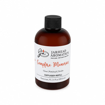 A brown bottle labeled Jarhead Aromatics Campfire Memories Diffuser Refill | Maple, Clove & Smoky Embers features warm notes of maple, clove, and smoky embers for a cozy autumn aroma. The 4 fl oz (118.2 mL) home fragrance liquid comes with a black cap.