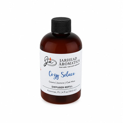 A 4 fl oz brown bottle of Jarhead Aromatics Cozy Solace Diffuser Refill, complete with a black cap, offers an inviting autumn home fragrance with a blend of fresh greens, jasmine, and oak moss.