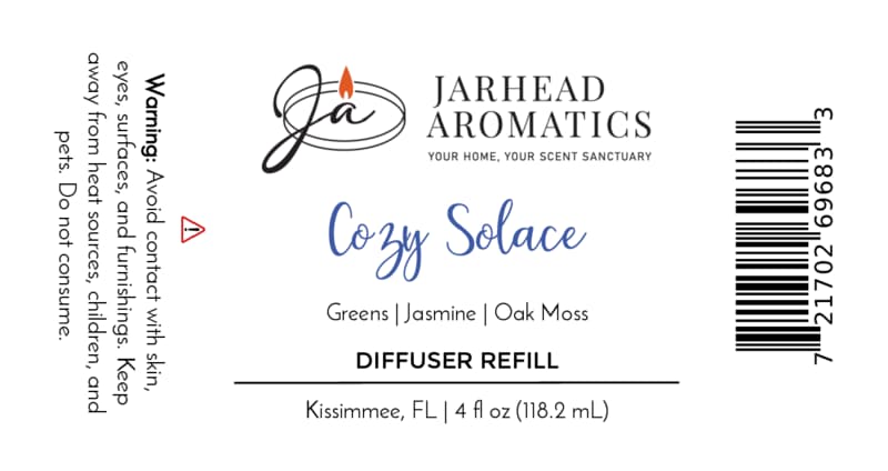 Jarhead Aromatics Cozy Solace Diffuser Refill Fresh Greens • Jasmine • Oak Moss Autumn-inspired home fragrance to elevate your space. Warning (left): Avoid contact with skin, eyes, and surfaces. Keep out of reach of children and pets. Net Contents: 118.2 mL [Barcode on right].