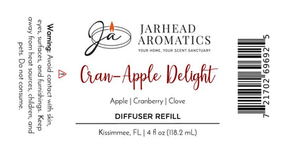 Label for Jarhead Aromatics Cran-Apple Delight Diffuser Refill | Cranberry, Apple & Warm Cinnamon, featuring a cozy home fragrance blend of cranberry, apple, and warm cinnamon—ideal for autumn. Includes a caution about skin and pet contact, company logo, product details, and barcode.