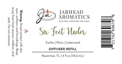 Label for Six Feet Under Diffuser Refill | Damp Earth, Moss & Ancient Oak by Jarhead Aromatics. Fragrance notes: damp earth, moss, and ancient oak—a truly earthy home scent with subtle graveyard undertones. Includes safety warnings about contact and usage. Barcode and product information displayed. 4 fl oz (118.2 mL), Kissimmee, FL.