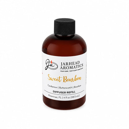 A brown bottle labeled Jarhead Aromatics Sweet Bourbon Diffuser Refill fills your space with the warm, inviting aromas of bourbon, butterscotch, and brown sugar. The 4 oz (118.2 mL) bottle features a black cap and is designed to create a cozy atmosphere reminiscent of a bourbon lounge.