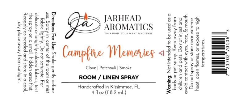 Jarhead Aromatics Campfire Memories Room & Linen Spray label featuring usage directions, scent notes (maple, clove, smoky embers) for a smoky home fragrance experience, warning, and product details; white background with orange and black text, and a candle logo.