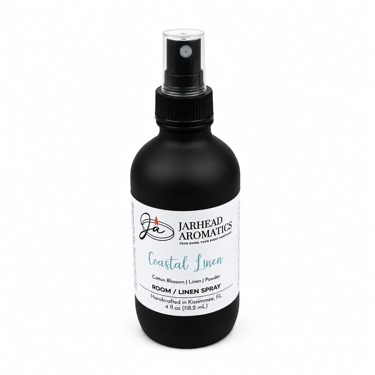 A black spray bottle labeled Jarhead Aromatics Coastal Linen Room & Linen Spray brings a premium home fragrance to any space, featuring fresh linen, ozone, and sandalwood notes. This 4 fl oz (118.2 ml) spray is perfect for refreshing rooms or linens.