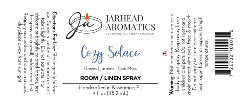 Jarhead Aromatics Cozy Solace Room & Linen Spray label featuring instructions, warnings, the Jarhead Aromatics logo, and scent details—highlighting notes of fresh greens, jasmine, and oak moss in a 4 fl oz bottle—for a refreshing home fragrance. Handcrafted in Kissimmee, FL.