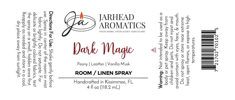 White label for Jarhead Aromatics Dark Magic Room & Linen Spray (Peach, Plum, Dark Florals & Vanilla Musk). Includes directions, warning, scent notes (peach, plum, dark florals, vanilla musk), and states “Handcrafted in Kissimmee, FL.” This home fragrance label features black and red text with a candle logo.