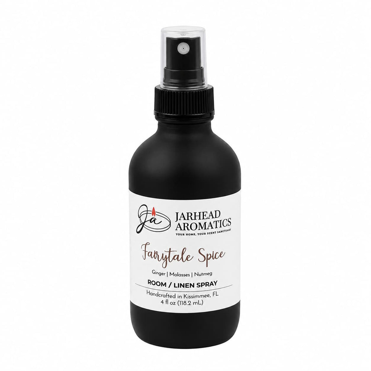 A black spray bottle labeled Jarhead Aromatics, Fairytale Spice Room & Linen Spray | Gingerbread, Molasses & Warm Spice, delivers a bakery-inspired home fragrance featuring notes of gingerbread, molasses, and warm spice. Reminiscent of a gingerbread house scent, this handcrafted 4 fl oz bottle is made with care in Kissimmee, FL.