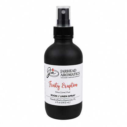A black spray bottle labeled Jarhead Aromatics Fruity Eruption Room & Linen Spray features refreshing notes of lemon, lime, grapefruit, and fresh fruit. Handcrafted in Kissimmee, FL, this 4 oz (118.2 ml) citrus room spray is perfect for elevating your home fragrance experience.