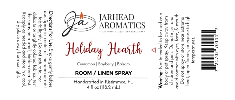Jarhead Aromatics Holiday Hearth Room & Linen Spray label featuring directions, warnings, a barcode, and scent notes of cinnamon, bayberry, and balsam for a festive Christmas room spray.