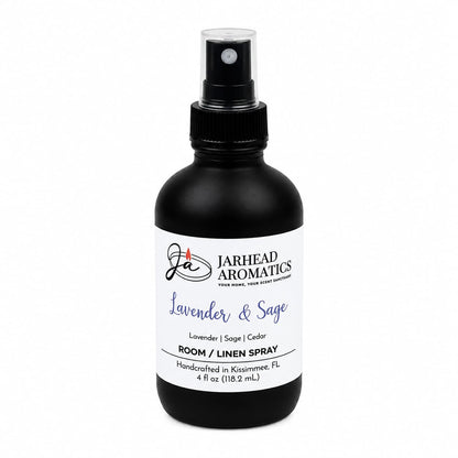 A black spray bottle labeled Jarhead Aromatics Lavender & Sage Room & Linen Spray | Lavender, Sage & Sandalwood offers a calming home fragrance with soothing notes of lavender, sage, and sandalwood. Handcrafted in Kissimmee, FL, this room and linen spray is perfect for refreshing any space or as a linen spray. The bottle size is 4 fl oz (118.2 ml).