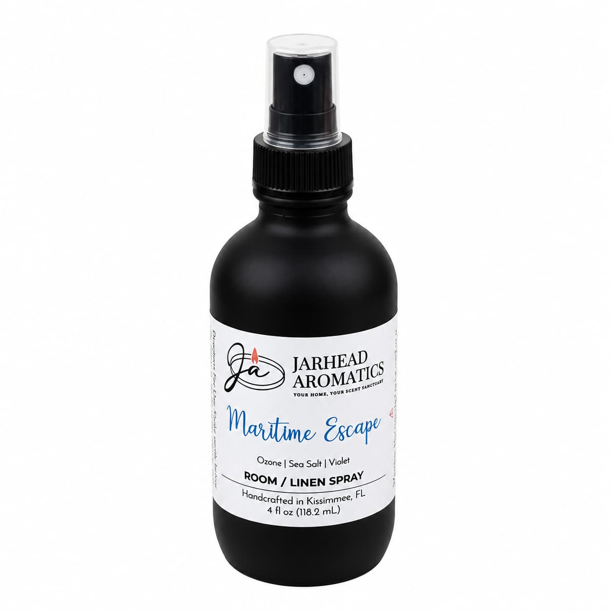 A black spray bottle labeled Jarhead Aromatics Maritime Escape Room & Linen Spray provides a refreshing coastal scent with notes of sea salt, ozone, and jasmine. The label emphasizes that this handcrafted home fragrance is made in Kissimmee, FL, and the bottle contains 4 fl oz (118.2 ml).