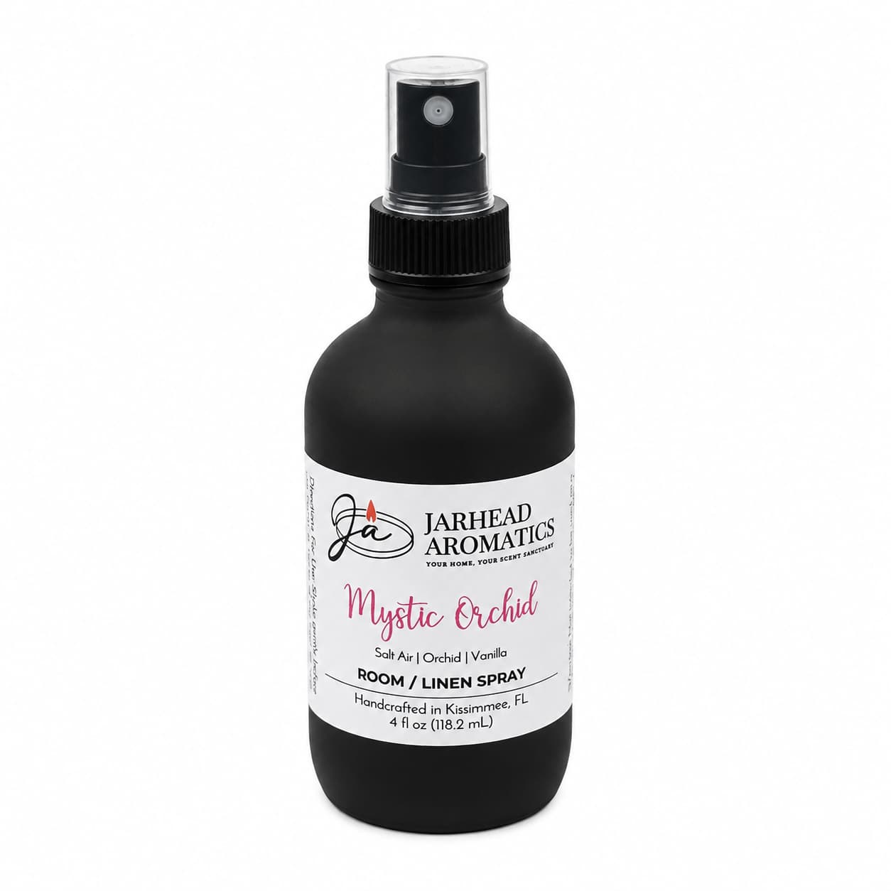The Jarhead Aromatics Mystic Orchid Room & Linen Spray features a sleek black spray bottle and blends scent notes of orchid, salt air, and vanilla. Handcrafted in Kissimmee, FL, this home fragrance infuses your space with a refreshing coastal floral aroma, creating a serene oasis.