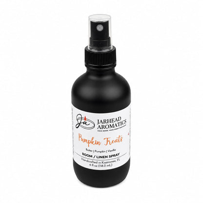 A black spray bottle labeled Jarhead Aromatics Pumpkin Treats Room & Linen Spray features an inviting fall fragrance with notes of pumpkin, caramel, and maple pecan. This 4 fl oz bottle is the perfect home fragrance, handcrafted in Kissimmee, FL.