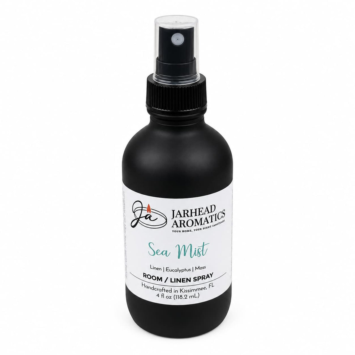 A black spray bottle labeled Jarhead Aromatics Sea Mist Room & Linen Spray features refreshing scent notes of fresh linen, sea salt, and eucalyptus. Handcrafted in Kissimmee, FL, this spa-inspired coastal home fragrance is available in a 4 fl oz size.