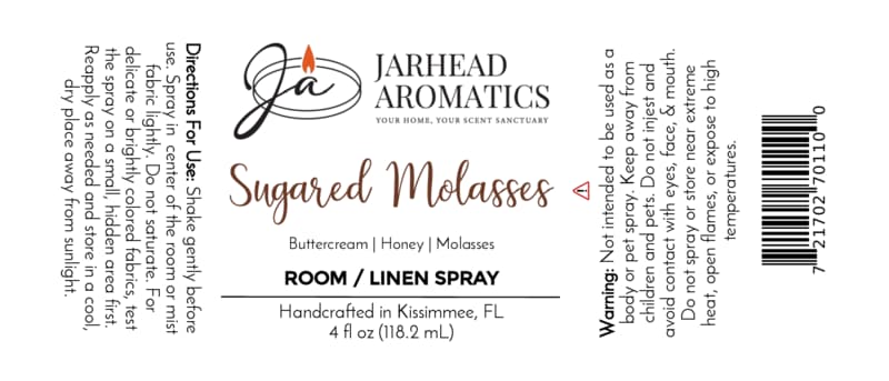 White product label for Jarhead Aromatics Sugared Molasses Room & Linen Spray | Buttercream, Honey & Dark Molasses, a gourmand home fragrance ideal for rooms or linens. Includes directions, warnings, and full ingredient list; features black, brown, and orange text with a flame logo.