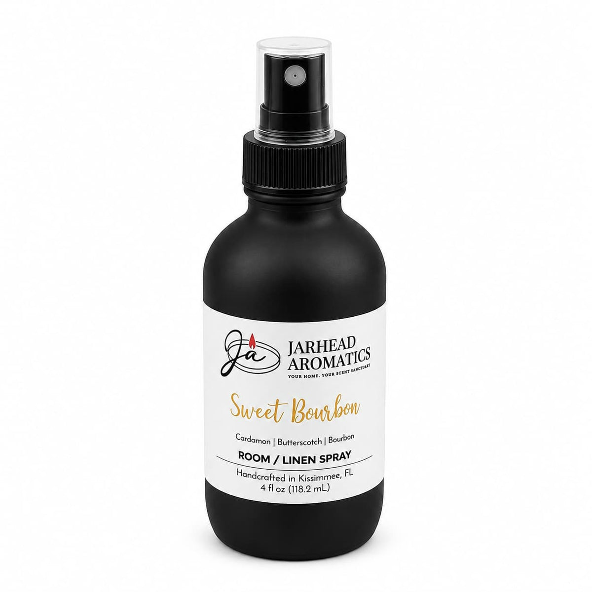 A black spray bottle labeled Jarhead Aromatics Sweet Bourbon Room & Linen Spray features notes of bourbon, butterscotch, and brown sugar. This handcrafted gourmand fragrance creates a warm, inviting atmosphere in your home. The 4 fl oz bottle is expertly made in Kissimmee, FL.