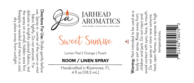 Here’s the revised sentence using your product data: White label for Jarhead Aromatics Sweet Sunrise Room & Linen Spray | Lemon, Orange, Peach & Citrus with directions, warnings, and ingredients (lemon peel, orange, peach). This fruity room and linen spray is handcrafted in Kissimmee, FL. 4 fl oz bottle. Orange and black text with a candle logo.
