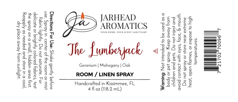 White label for The Lumberjack Room & Linen Spray | Mahogany, Cedarwood & Oak by Jarhead Aromatics, highlighting a woodsy home fragrance blend of mahogany, cedarwood, and oak. Features usage directions, warnings, and product details presented in black and red text.