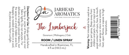 White label for The Lumberjack Room & Linen Spray | Mahogany, Cedarwood & Oak by Jarhead Aromatics, highlighting a woodsy home fragrance blend of mahogany, cedarwood, and oak. Features usage directions, warnings, and product details presented in black and red text.