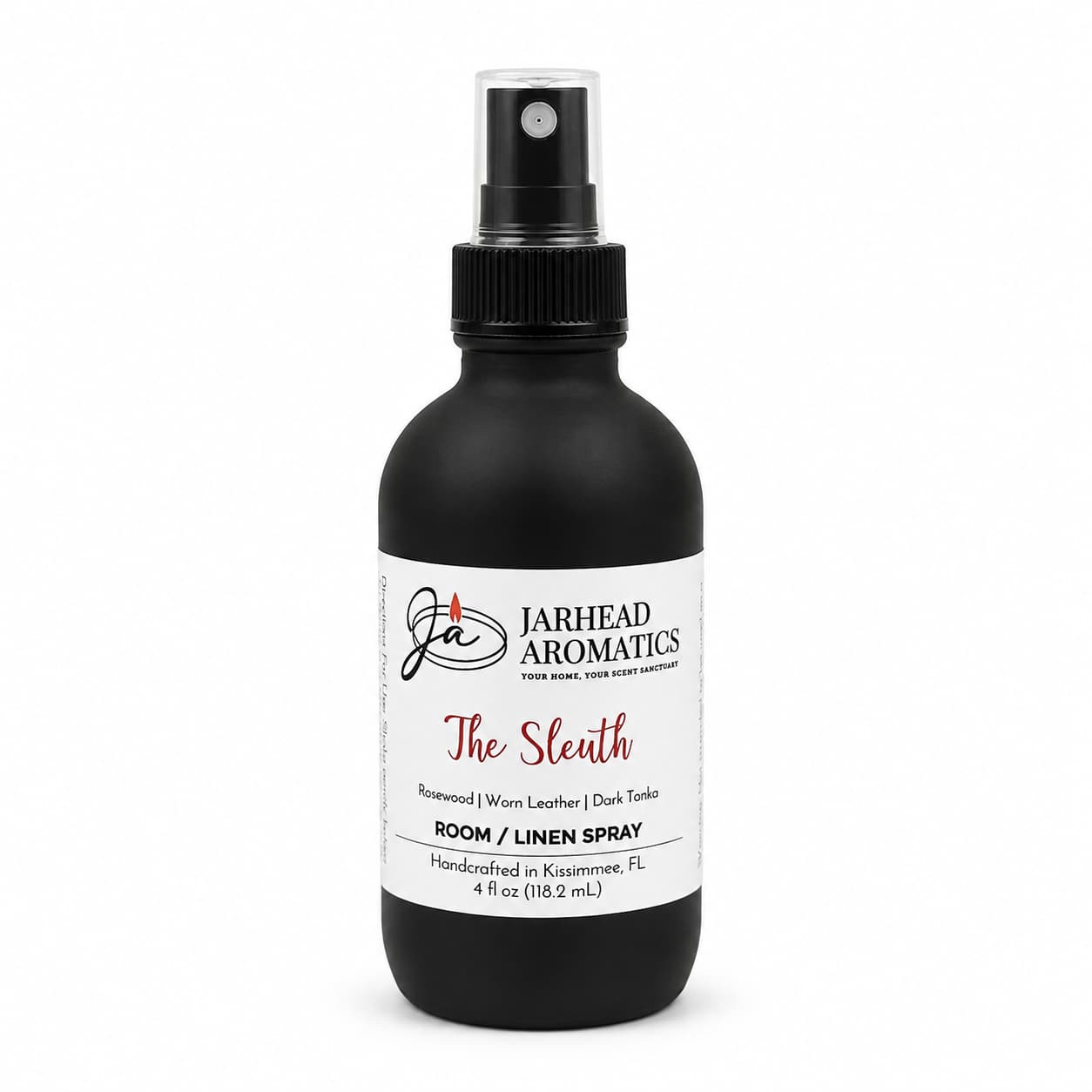 A black spray bottle labeled Jarhead Aromatics, The Sleuth Room & Linen Spray | Leather, Rosewood & Sandalwood, handcrafted in Kissimmee, FL and featuring notes of sandalwood, rosewood, worn leather, and dark tonka for a distinctive home fragrance experience.