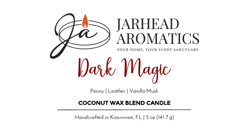 Jarhead Aromatics Dark Magic - Coconut Wax Blend Candle label with a flame, cursive text, and scent notes of peony, leather, and vanilla musk. Handcrafted in Kissimmee, FL. 5 oz floral perfume-inspired candle.