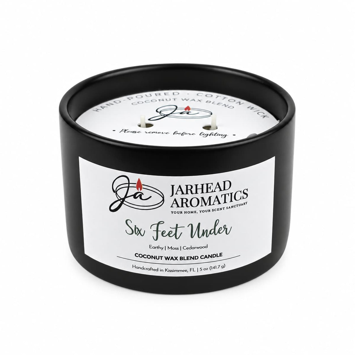 A black, cemetery-inspired Six Feet Under Coconut Wax Blend Candle by Jarhead Aromatics in a matte jar with a white label featuring the product name, scent profile, and brand details.