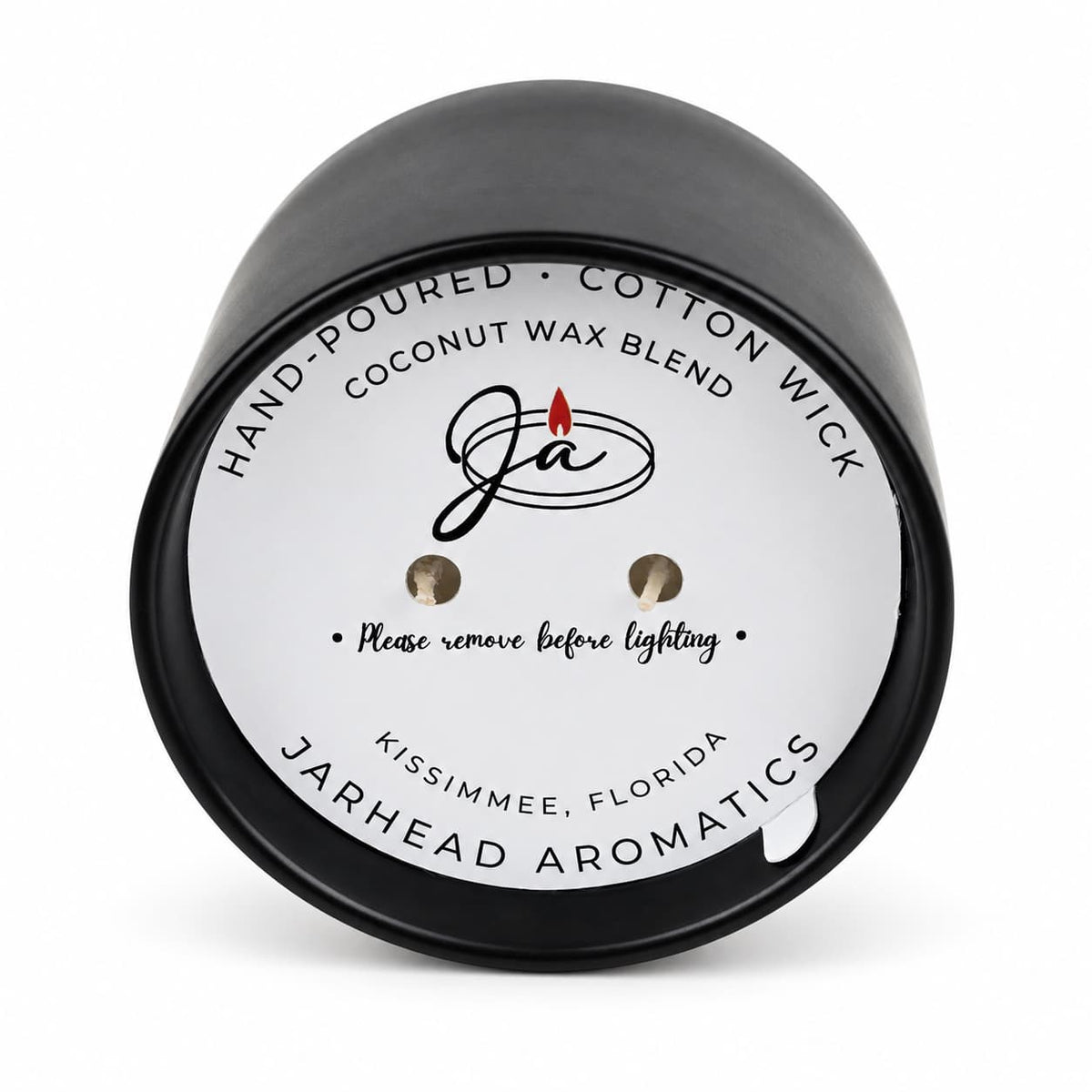 A black, two-wick Coconut Wax Blend Candle, featuring a round label with hand-poured coconut wax blend details and instructions to remove the label before lighting.