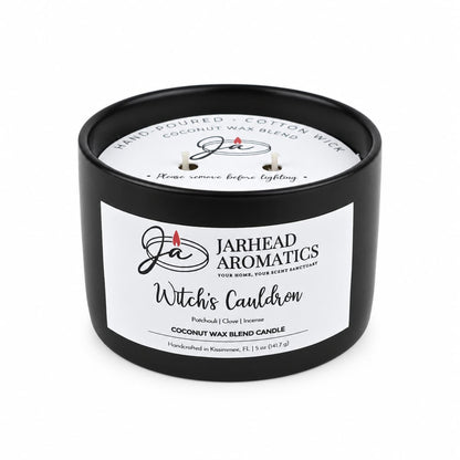 A black, two-wick Witches Cauldron Coconut Wax Blend Candle in a ceramic container, featuring patchouli, clove, and incense notes in a coconut wax blend.