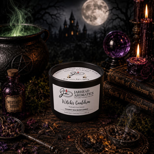 A black Witches Cauldron Coconut Wax Blend Candle sits on a wooden table surrounded by fragrance oil, a crystal ball, old books, and potion bottles against a spooky moonlit background.